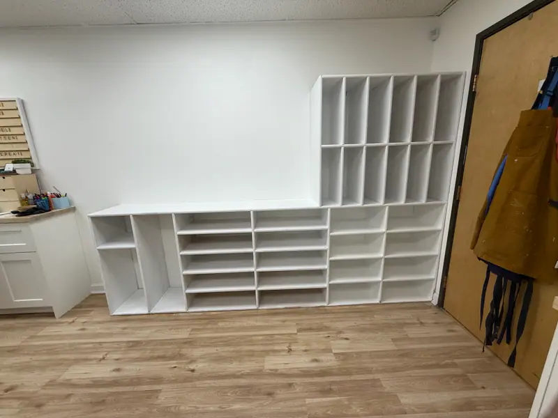 Built-in cubby shelving finished in white