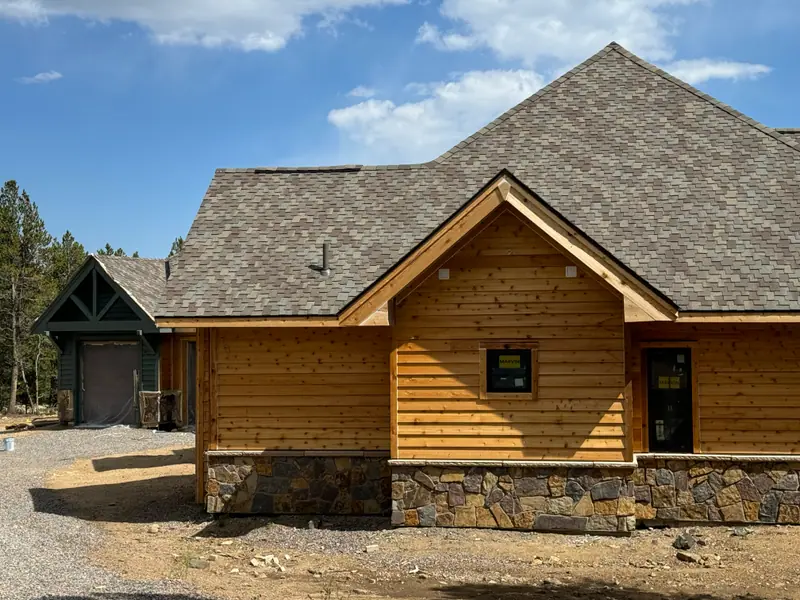 Log home exterior finished with a clear protective stain