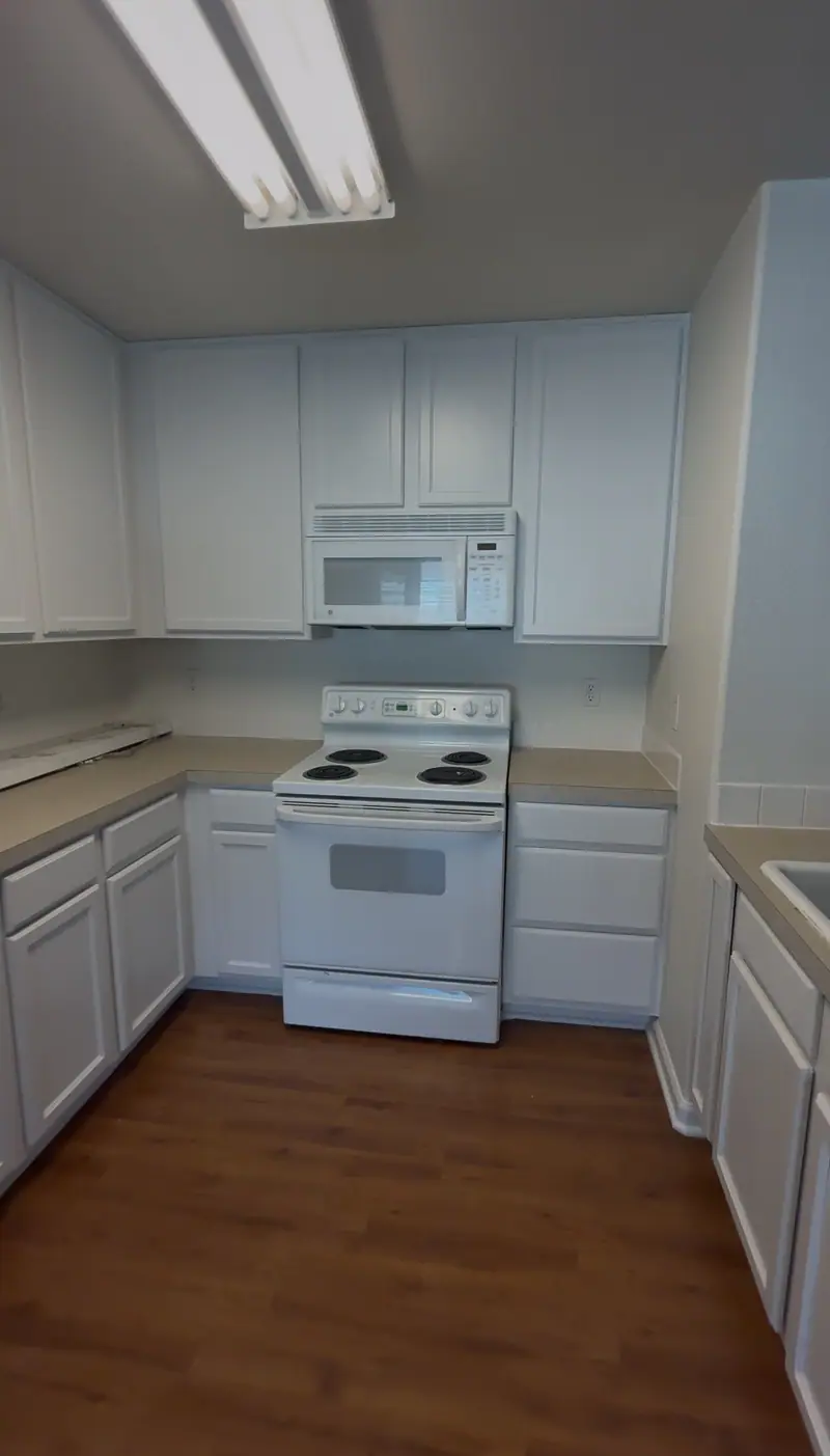 The same kitchen after cabinets were repainted white